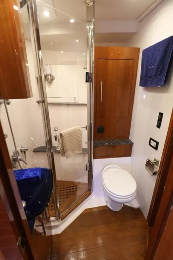 Blue Stiel Yacht Photos Pics Luxurious bathroom in 2009 Regal 52 Sport Coupe yacht with modern fixtures and wooden accents.