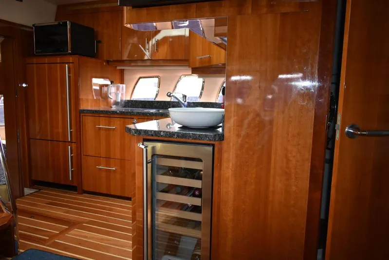 Blue Stiel Yacht Photos Pics Luxurious 2009 Regal 52 Sport Coupe yacht interior with sleek wooden cabinetry and modern amenities.