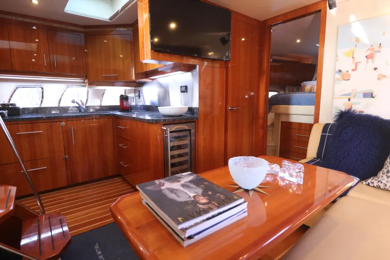 Blue Stiel Yacht Photos Pics Luxurious interior of 2009 Regal 52 Sport Coupe yacht with modern kitchen and cozy seating area.