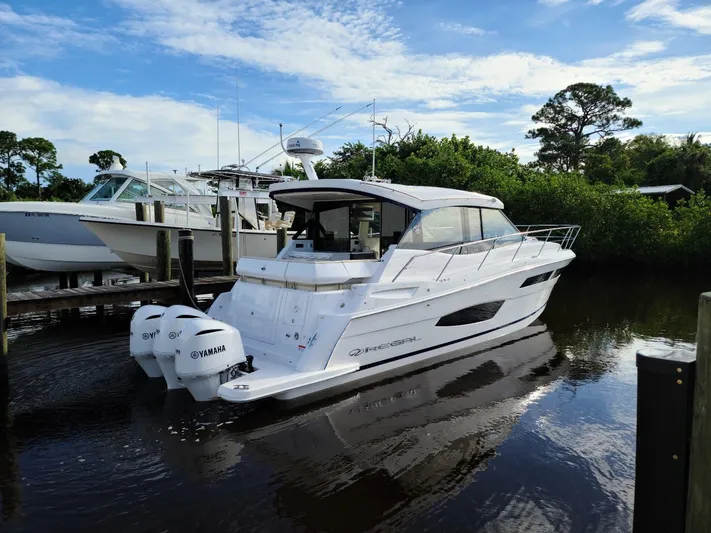 2021 Regal 38 Xo Yacht Photos Pics 2021 Regal 38 XO yacht docked, featuring sleek design and twin Yamaha engines.