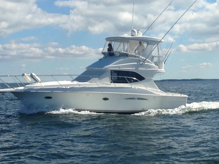 Sea Marie Yacht Photos Pics 2007 Silverton 38 Convertible yacht cruising on open water under a partly cloudy sky.