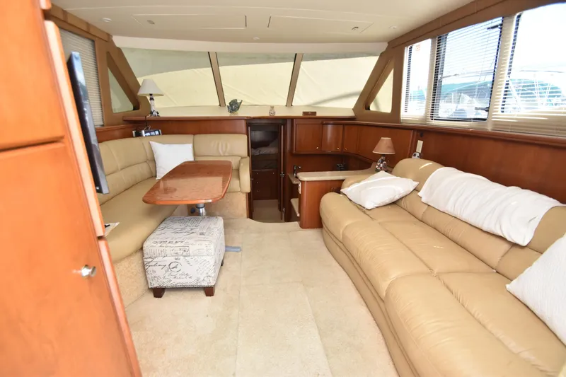 Sea Marie Yacht Photos Pics Luxurious interior of 2007 Silverton 38 Convertible yacht with beige leather seating.