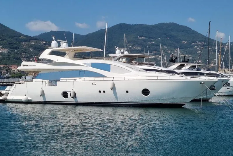 Red Rose Yacht Photos Pics Luxury Aicon 85 yacht from 2010 docked in scenic marina with mountains.