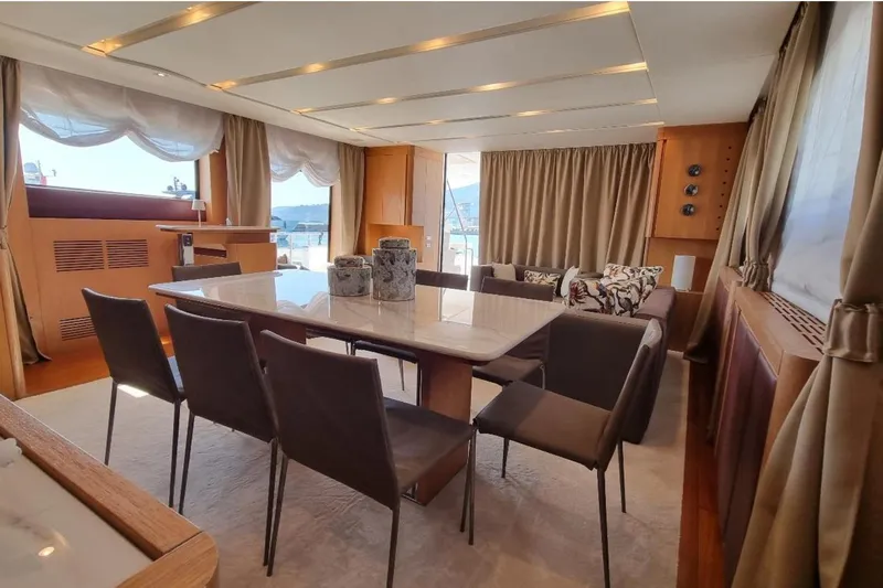 Red Rose Yacht Photos Pics Luxurious interior of 2010 Aicon 85 yacht with elegant dining area and panoramic windows.