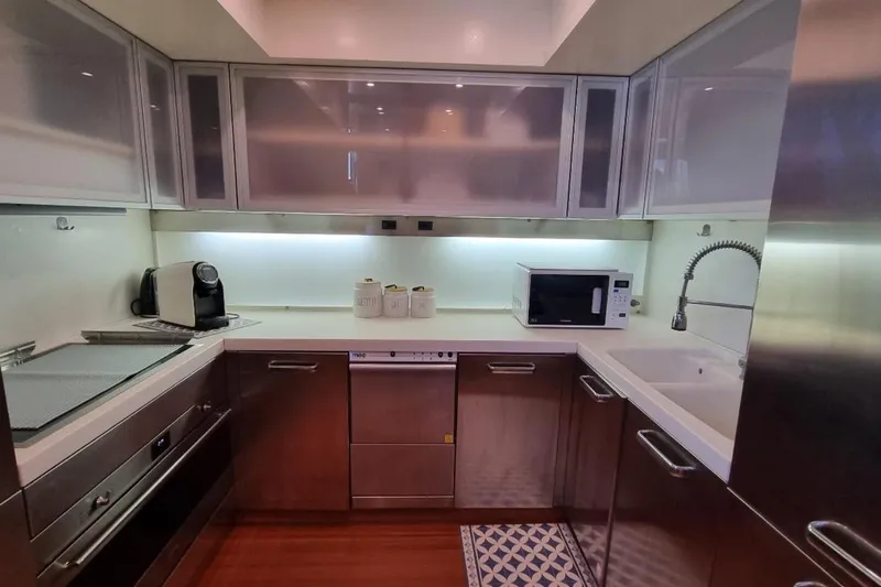 Red Rose Yacht Photos Pics Modern kitchen interior on 2010 Aicon 85 yacht with sleek appliances and cabinetry.