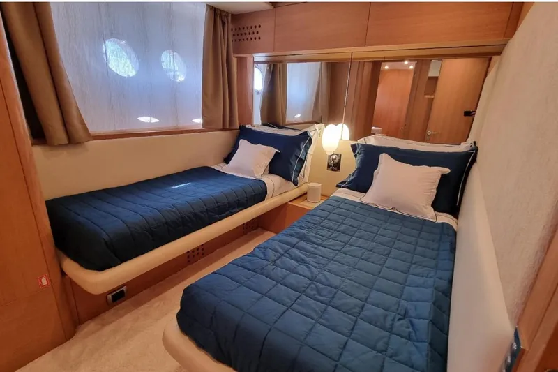 Red Rose Yacht Photos Pics Luxurious twin cabin interior of 2010 Aicon 85 yacht with blue bedding.
