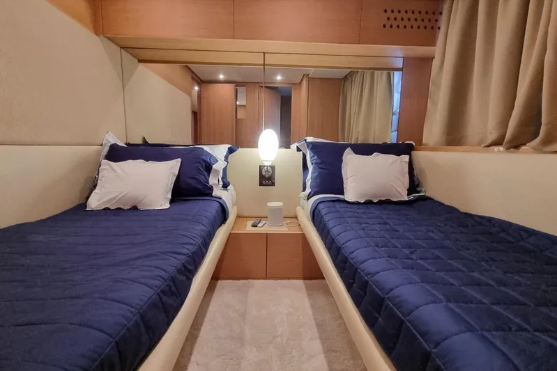 Red Rose Yacht Photos Pics Luxurious twin cabin in 2010 Aicon 85 yacht with blue bedding and modern decor.