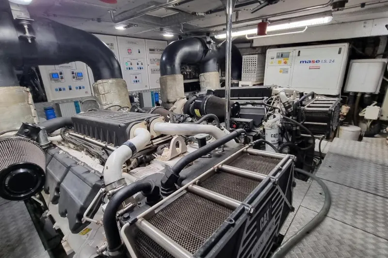 Red Rose Yacht Photos Pics Engine room of a 2010 Aicon 85 yacht, featuring advanced machinery and control panels.