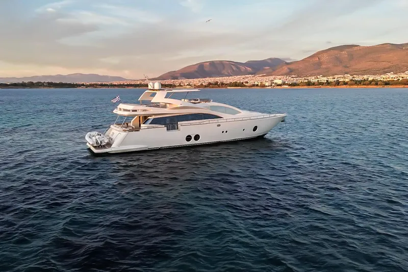 Red Rose Yacht Photos Pics Luxurious 2010 Aicon 85 yacht cruising on serene waters with scenic mountain backdrop.