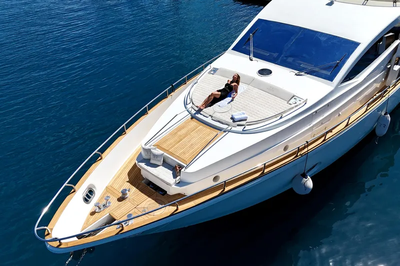 Red Rose Yacht Photos Pics Luxurious 2010 Aicon 85 yacht with sunbathing area on serene blue water.