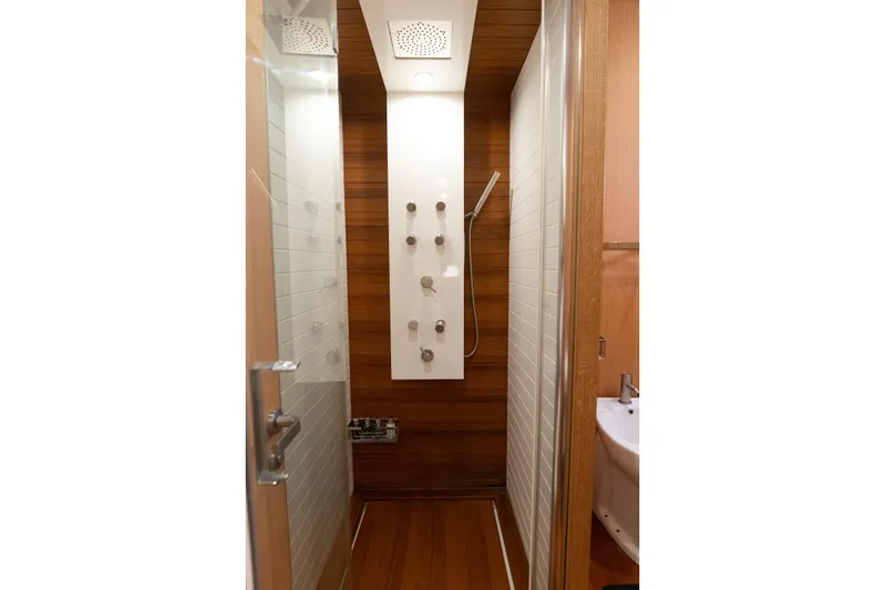 Red Rose Yacht Photos Pics Luxurious shower in 2010 Aicon 85 yacht, featuring modern fixtures and wood paneling.