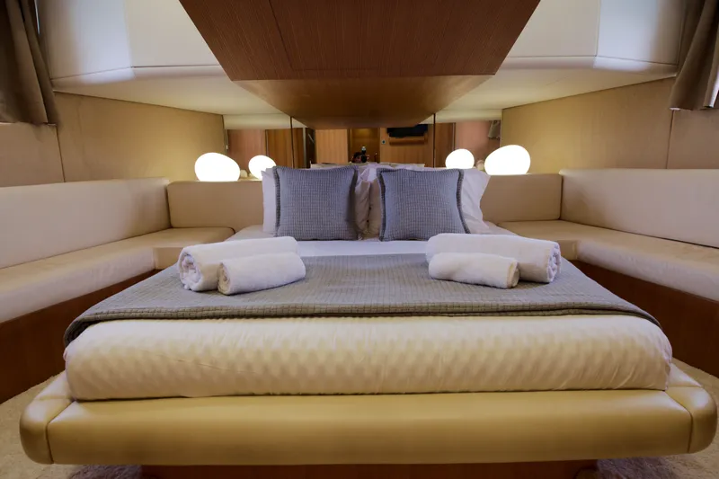 Red Rose Yacht Photos Pics Luxurious bedroom interior of 2010 Aicon 85 yacht with elegant bedding and ambient lighting.