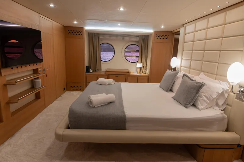 Red Rose Yacht Photos Pics Luxurious bedroom interior on 2010 Aicon 85 yacht with elegant decor and ocean view.