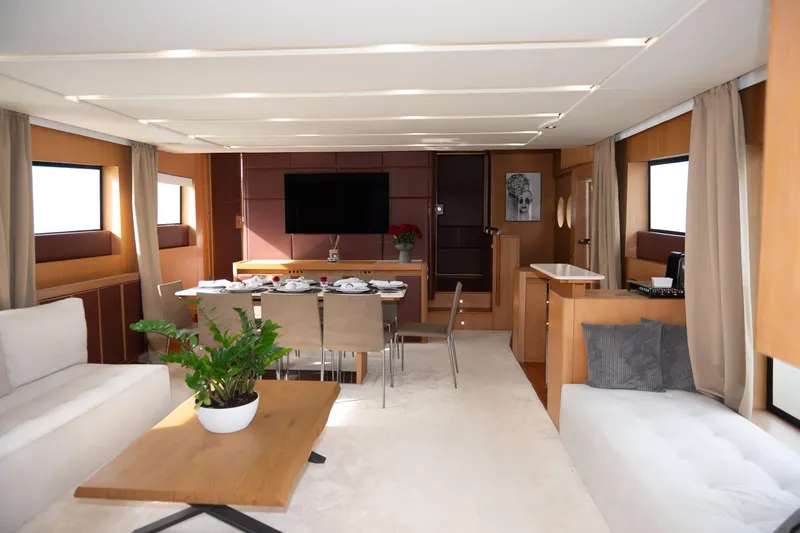 Red Rose Yacht Photos Pics Luxurious interior of 2010 Aicon 85 yacht with elegant dining area and modern decor.
