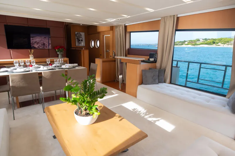 Red Rose Yacht Photos Pics Luxurious interior of 2010 Aicon 85 yacht with elegant dining area and ocean view.