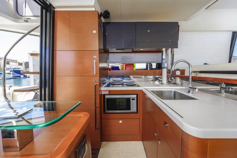 Shanti Yacht Photos Pics Luxurious kitchen interior of 2015 Prestige 500FB yacht with modern appliances and sleek design.
