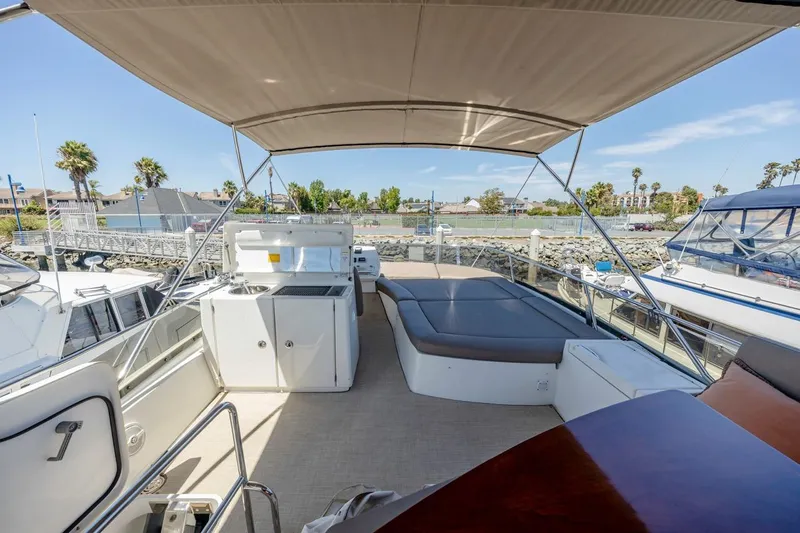 Shanti Yacht Photos Pics Spacious deck of 2015 Prestige 500FB yacht with seating and kitchenette.