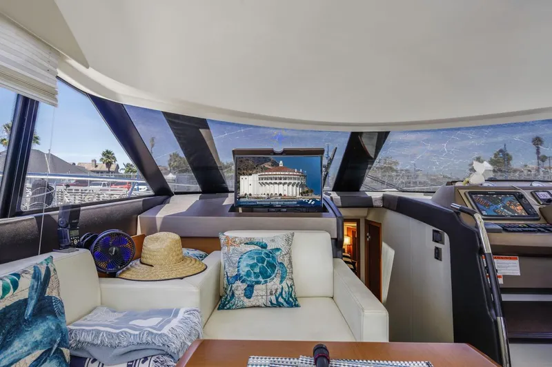 Shanti Yacht Photos Pics Luxurious interior of 2015 Prestige 500FB yacht with nautical decor and modern navigation equipment.