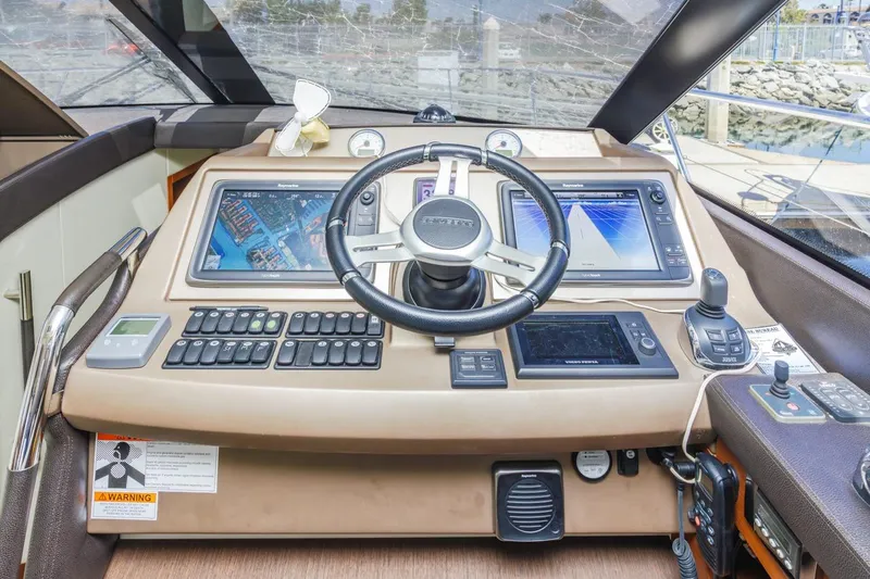 Shanti Yacht Photos Pics Cockpit of 2015 Prestige 500FB yacht with advanced navigation systems and controls.