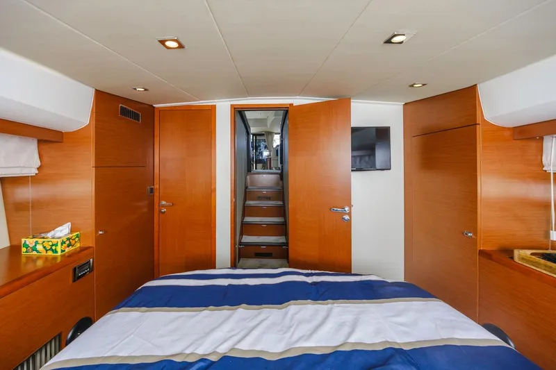Shanti Yacht Photos Pics Luxurious interior of 2015 Prestige 500FB yacht cabin with wooden finishes and modern design.