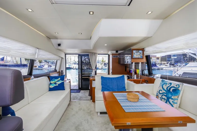 Shanti Yacht Photos Pics Luxurious interior of 2015 Prestige 500FB yacht with elegant seating and nautical decor.