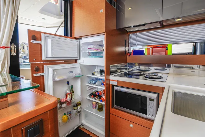 Shanti Yacht Photos Pics Modern kitchen in 2015 Prestige 500FB yacht with open fridge and microwave.