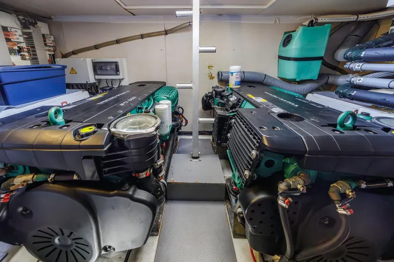 Shanti Yacht Photos Pics Engine room of a 2015 Prestige 500FB yacht, featuring dual engines and organized equipment.