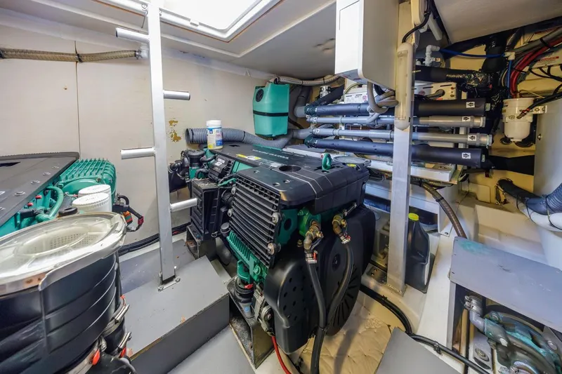 Shanti Yacht Photos Pics Engine room of a 2015 Prestige 500FB yacht, showcasing mechanical components and systems.