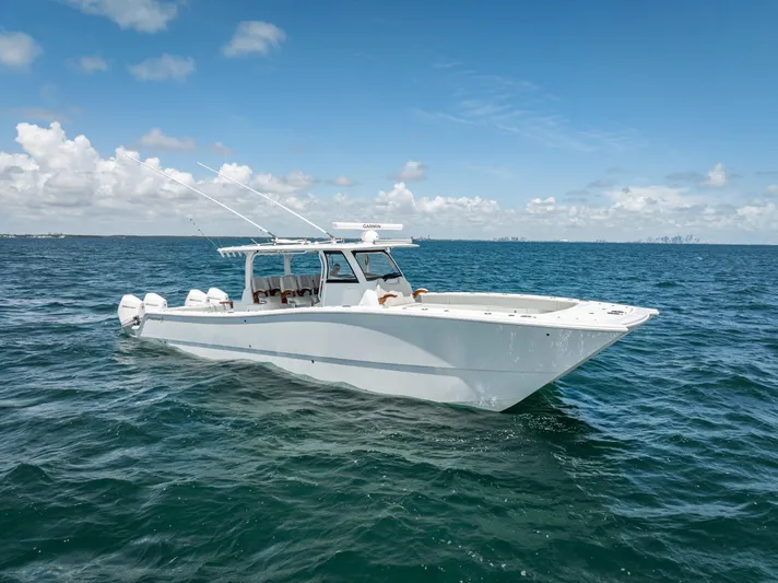  Yacht Photos Pics 2023 Freeman 43 boat cruising on open water under a clear blue sky.