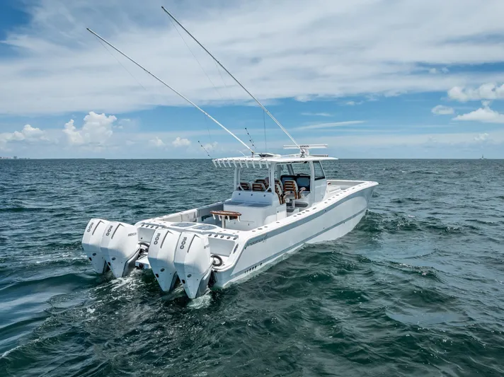  Yacht Photos Pics 2023 Freeman 43 boat cruising on open ocean under clear blue sky.