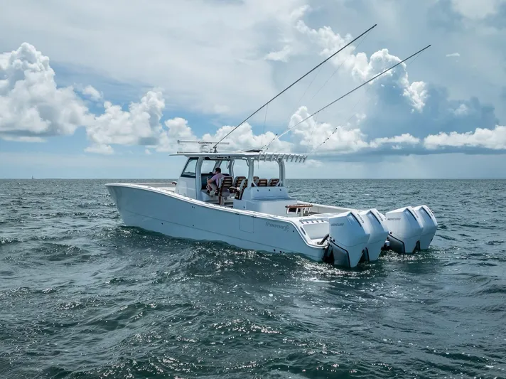  Yacht Photos Pics 2023 Freeman 43 boat cruising on open sea under cloudy sky.