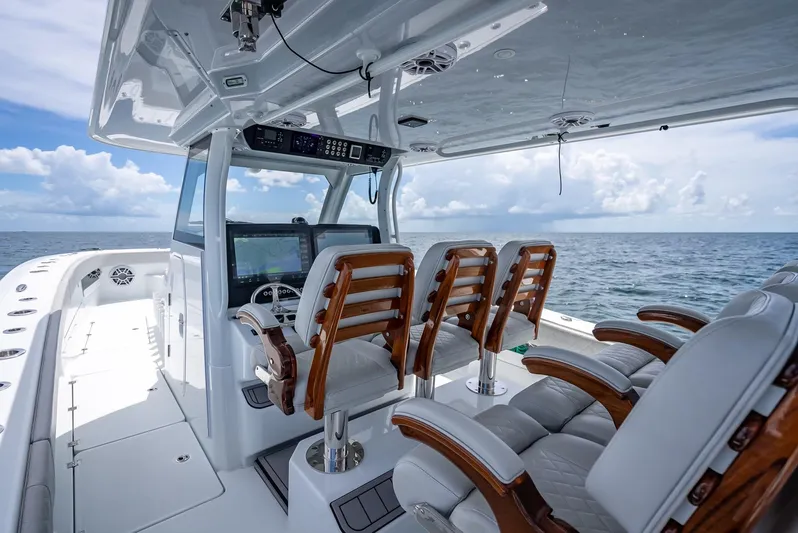  Yacht Photos Pics Luxurious 2023 Freeman 43 boat interior with wooden seats and ocean view.