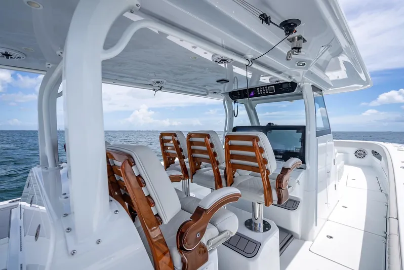  Yacht Photos Pics Luxurious 2023 Freeman 43 boat interior with wooden seats and ocean view.