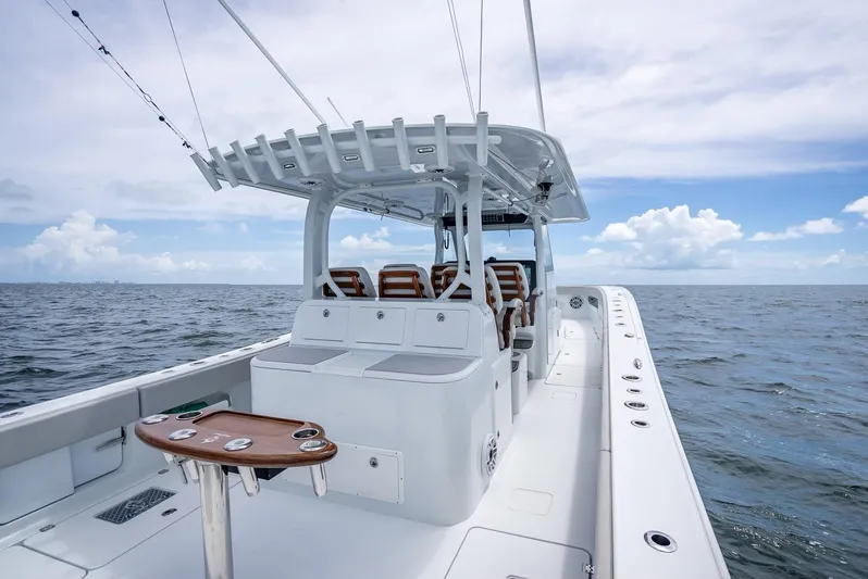  Yacht Photos Pics 2023 Freeman 43 boat on open water, featuring spacious deck and seating.