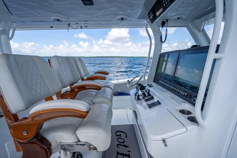  Yacht Photos Pics Freeman 43 boat interior with luxurious seating and advanced navigation system, 2023 model.
