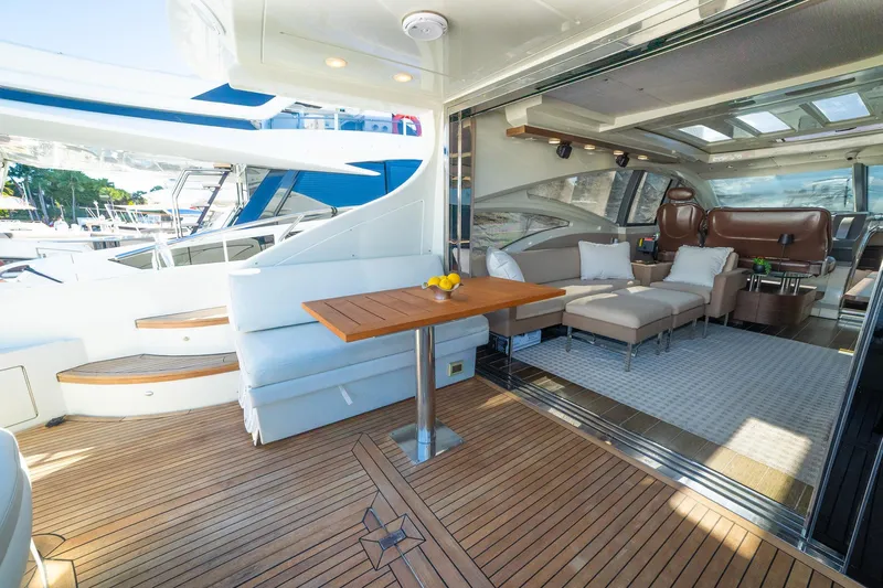 Boat Yacht Photos Pics Luxurious 2011 Azimut 68S yacht interior with elegant seating and wooden deck.