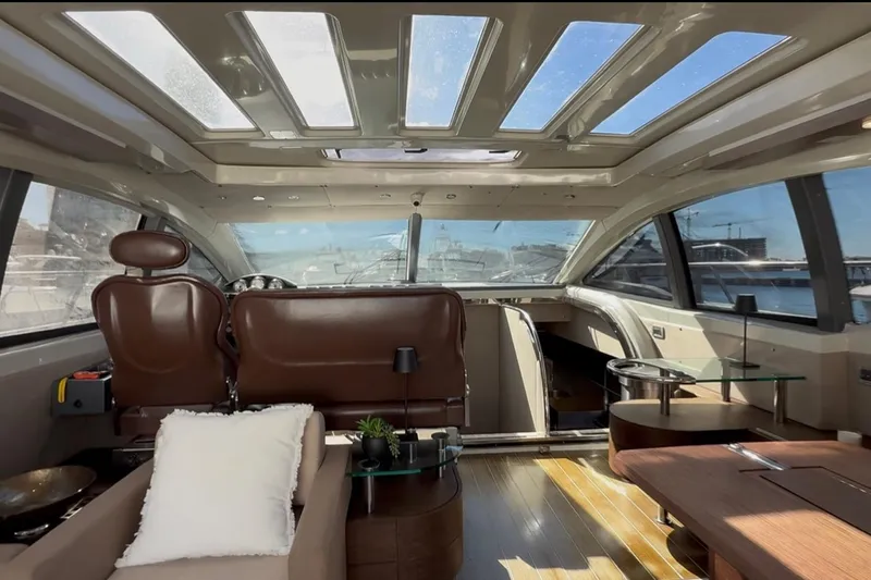 Boat Yacht Photos Pics Luxurious interior of 2011 Azimut 68S yacht with panoramic windows and elegant seating.