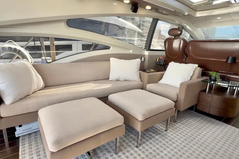 Boat Yacht Photos Pics Luxurious interior of 2011 Azimut 68S yacht with beige seating and modern decor.