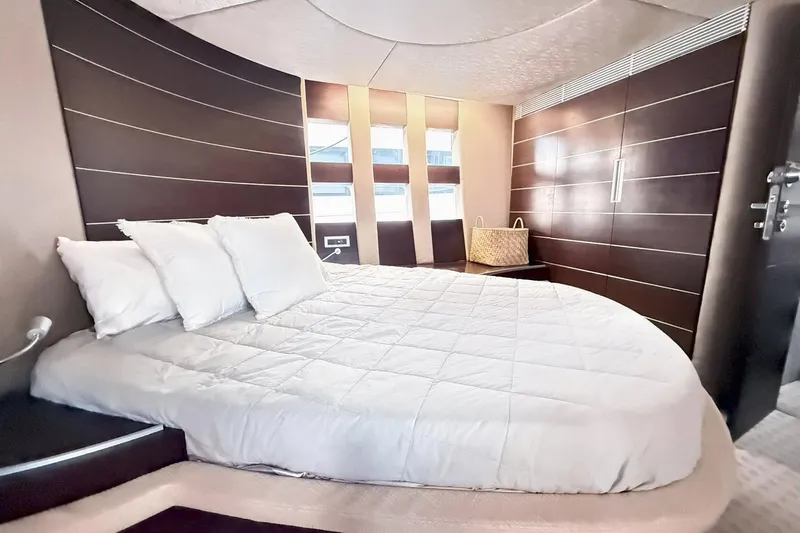 Boat Yacht Photos Pics Luxurious bedroom interior of 2011 Azimut 68S yacht with modern design and cozy bedding.