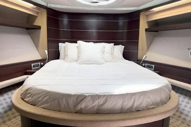 Boat Yacht Photos Pics Luxurious bedroom interior of 2011 Azimut 68S yacht with elegant bedding.