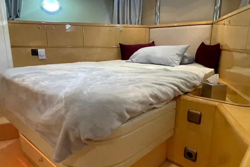  Yacht Photos Pics Luxurious bedroom interior of 1995 PR Marine 82 yacht with cozy bedding.