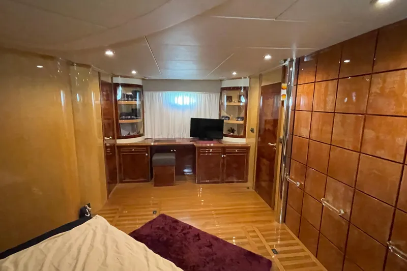  Yacht Photos Pics Luxurious interior of 1995 PR Marine 82 yacht with wood paneling and modern amenities.