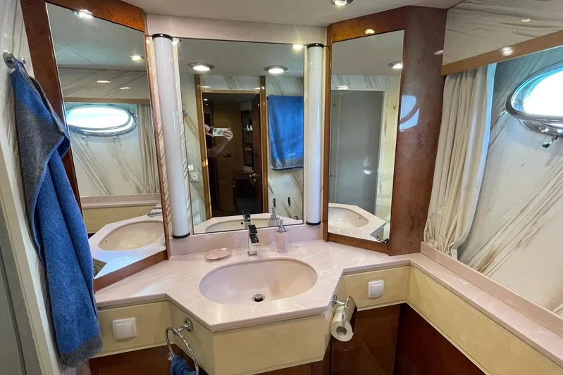  Yacht Photos Pics Luxurious bathroom on 1995 PR Marine 82 yacht with mirrors and porthole.