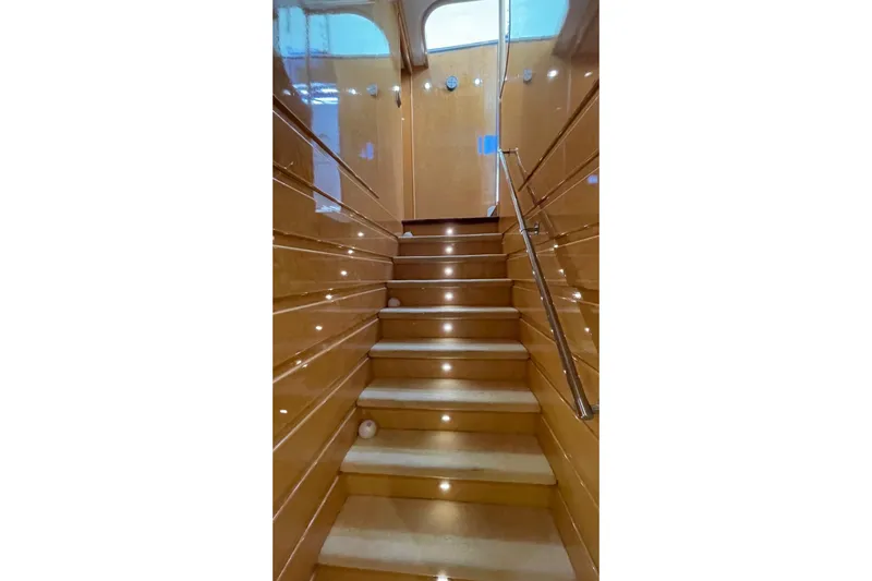 Yacht Photos Pics Staircase with wooden paneling and lights on a 1995 PR Marine 82 yacht.