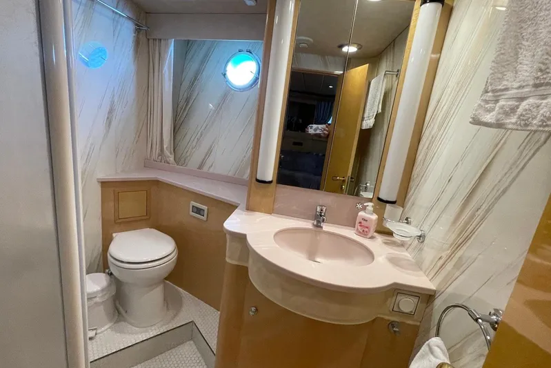  Yacht Photos Pics Luxurious bathroom in 1995 PR Marine 82 yacht with modern fixtures and elegant design.