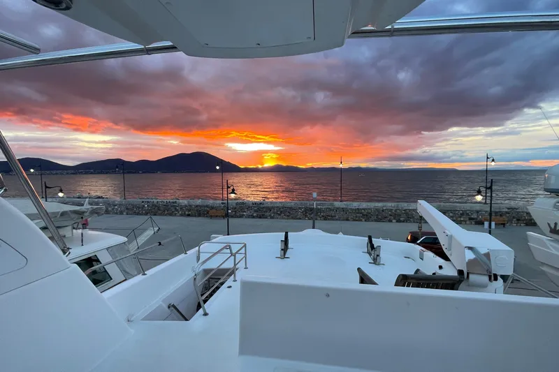  Yacht Photos Pics PR Marine 82 yacht at sunset, 1995 model, overlooking serene ocean and vibrant sky.