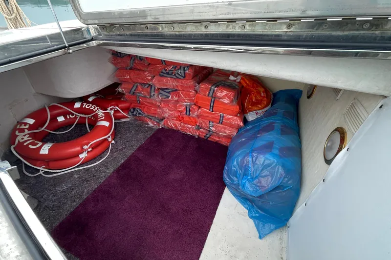  Yacht Photos Pics Storage compartment of 1995 PR Marine 82 with life jackets and lifebuoys.