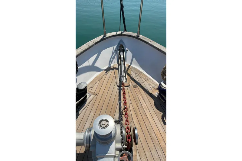  Yacht Photos Pics Bow of 1995 PR Marine 82 yacht with anchor chain and wooden deck.
