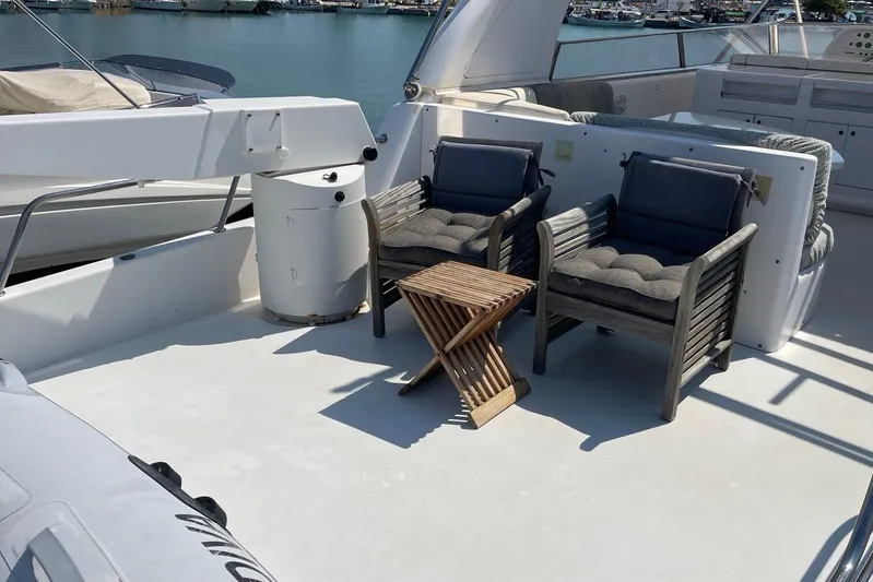  Yacht Photos Pics Luxury yacht deck with cushioned chairs and table, PR Marine 82, 1995 model.