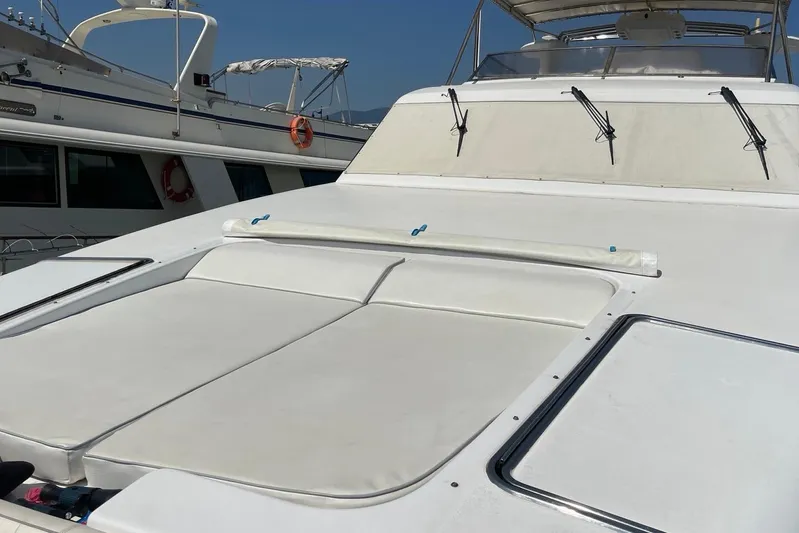  Yacht Photos Pics Luxury PR Marine 82 yacht deck, 1995 model, with white cushioned seating.